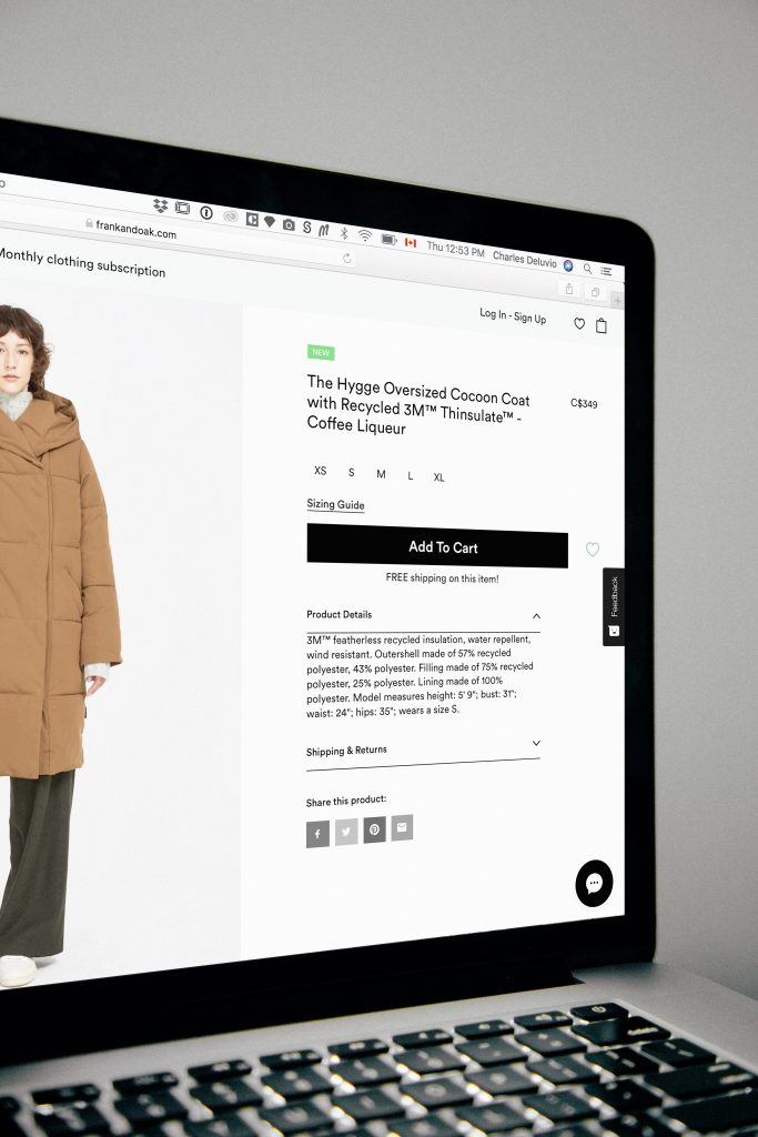 Example of shopping online for a coat on a MacBook. Photo Credit: Charles